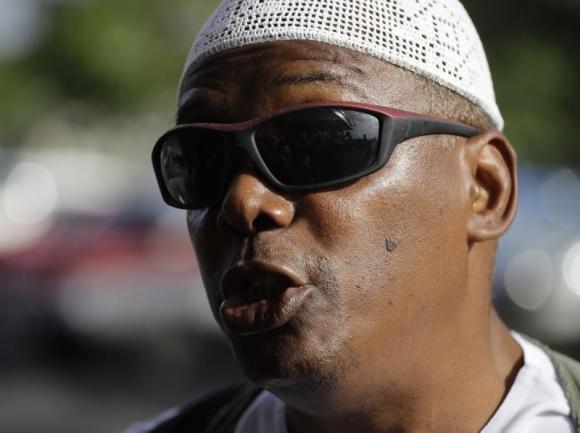 William Potts speaks to reporters outside Havana's Jose Marti International Airport, before boarding a plane to the U.S.