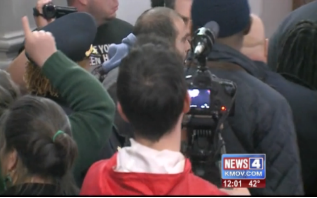 Witnesses say chaos erupted at St. Louis City Hall when a woman was pushed by a leader of the police union. (YouTube Screenshot)