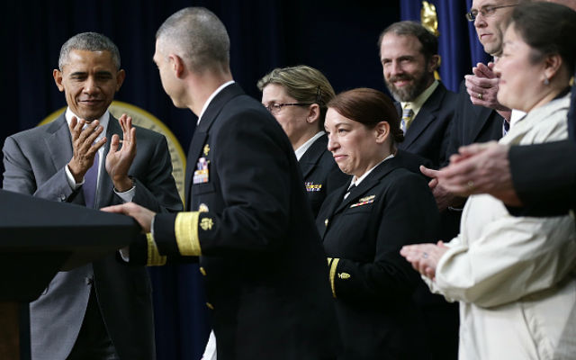 President Barack Obama applauds government and non-government medical professionals before speaking at the Eisenhower Executive Office Building February 11, 2015 in Washington, DC. Obama delivered remarks on the progress made to date and further action to take on the Ebola outbreak in West Africa. (Photo by Win McNamee/Getty Images)