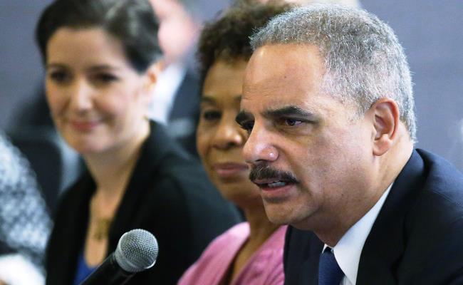 U.S. Attorney General Eric Holder (foreground) speaks during a Building Community Trust roundtable meeting on February 5, 2015 in Oakland, California. Shown behind him is Rep. Barbara Lee (D, Calif.) (Justin Sullivan/Getty Images)