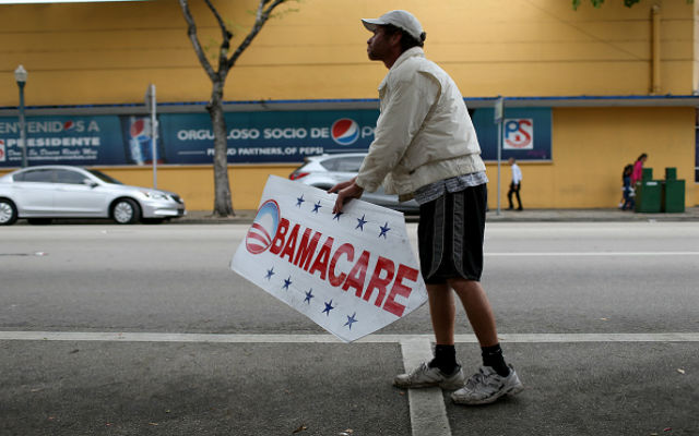  Pedro Rojas holds a sign directing people to an insurance company where they can sign up for the Affordable Care Act, also known as Obamacare, before the February 15th deadline on February 5, 2015 in Miami, Florida. Numbers released by the government show that the Miami-Fort Lauderdale-West Palm Beach metropolitan area has signed up 637,514 consumers so far since open enrollment began on Nov. 15, which is more than twice as many as the next large metropolitan area, Atlanta, Georgia. (Photo by Joe Raedle/Getty Images)