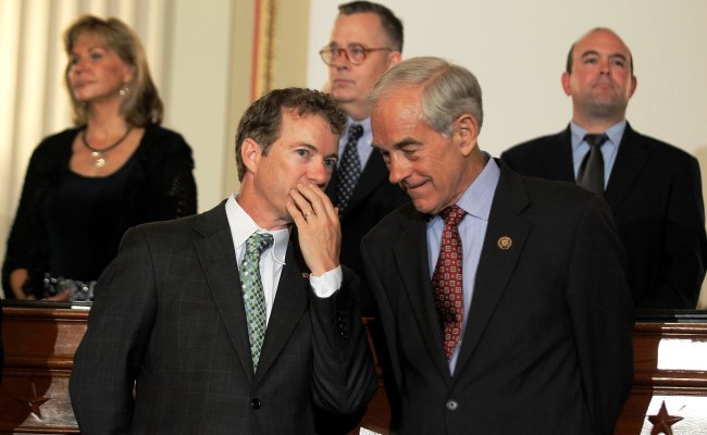  U.S. Sen. Rand Paul (R-KY) (L) talks to his father, former Rep. Ron Paul (R-TX) (R) during a news conference June 22, 2011 on Capitol Hill in Washington, DC.  (Alex Wong/Getty Images)