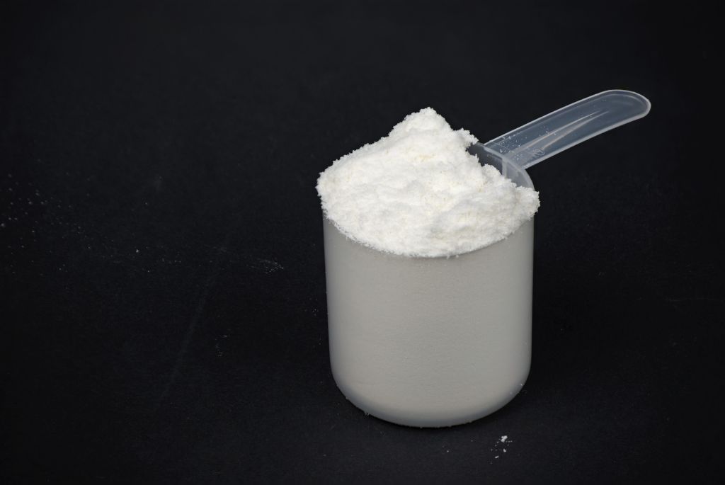 A scoop of protein powder drink