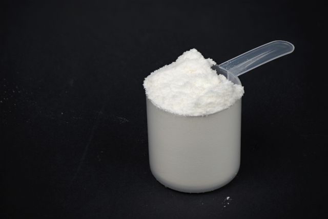 A scoop of protein powder drink