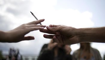 People smoke a joint during a demonstrat