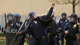 Baltimore police throw rocks