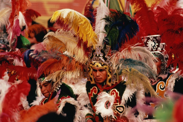 Mexico,Mexico City,Apache dancers performing in Aztec costumes
