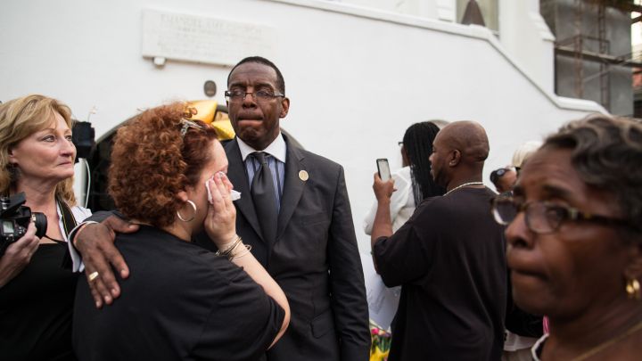 Church members comfort one another after Emanuel’s first service since the Charleston shooting.