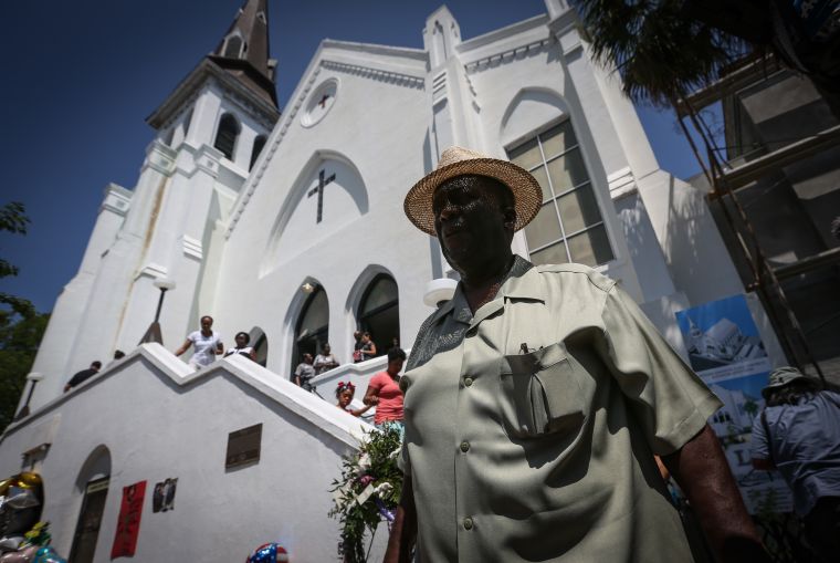 A member of the church is seen outside of Emanuel AME before its first service since the Charleston shooting.