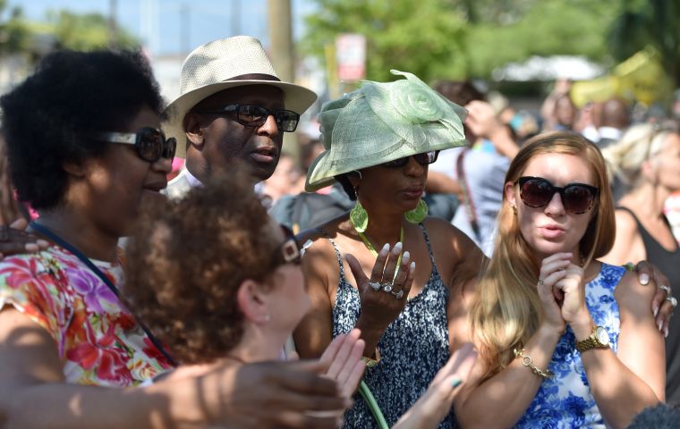 People pray and listen to the Sunday service outside of the Emanuel AME Church in Charleston, South Carolina.