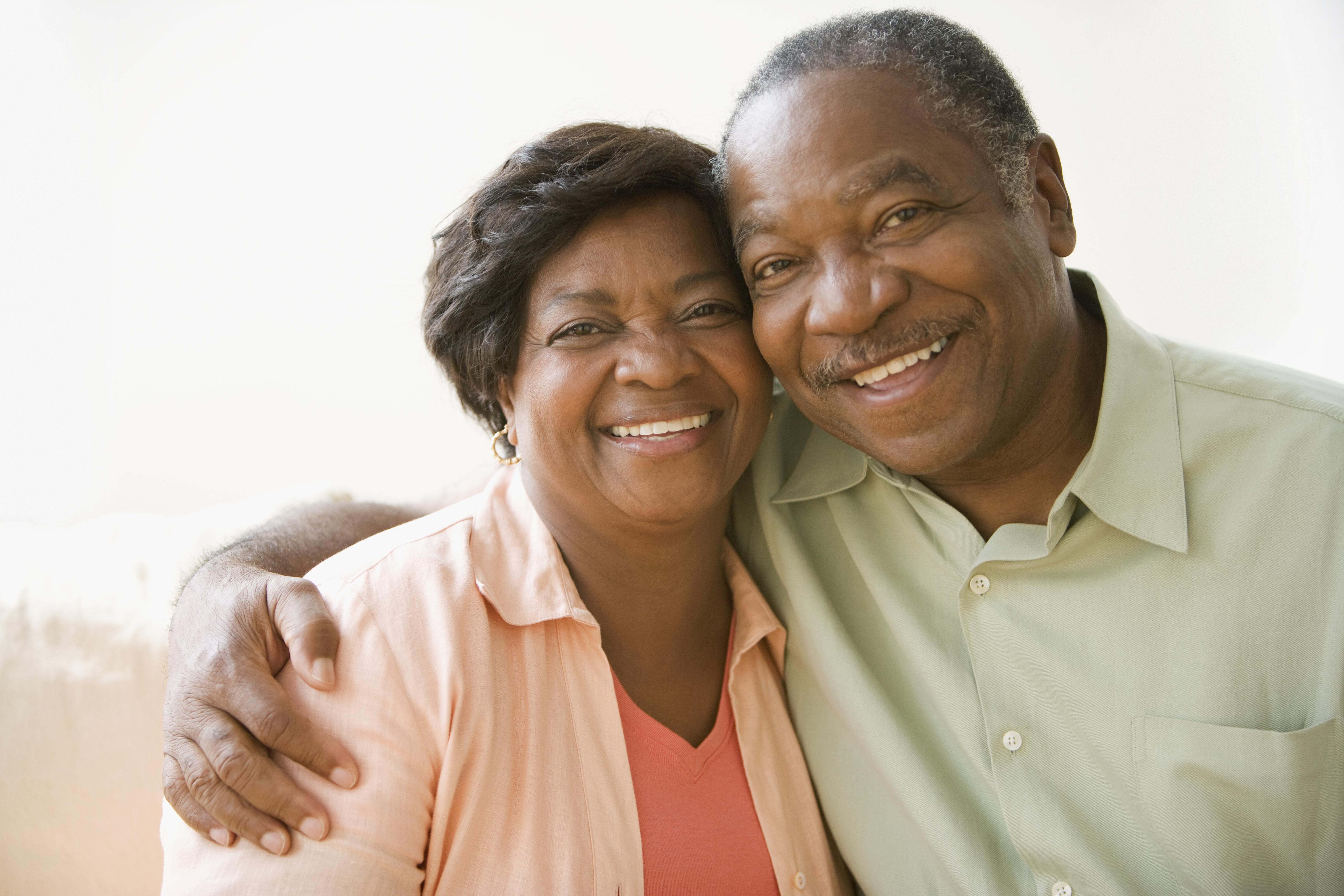Senior African couple hugging