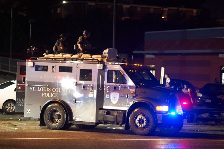 2015: St. Louis police with army gear arrive in Ferguson Sunday night.