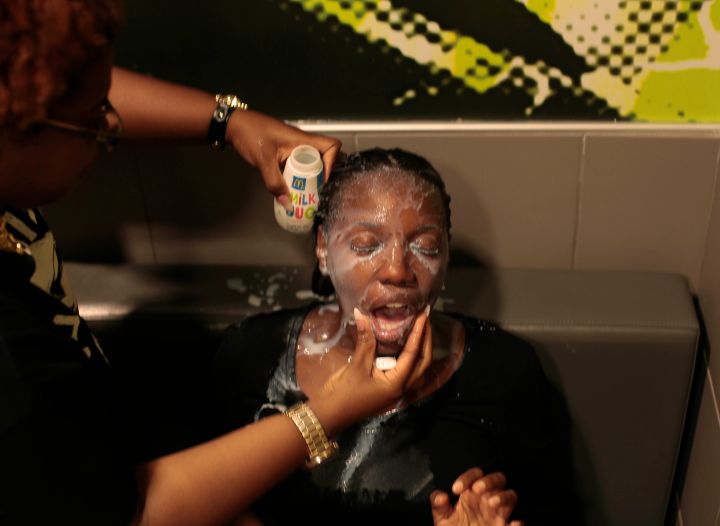 2014: A woman hit with pepper spray is doused with milk. Ferguson police issued curfews for protesters after incidents of arson and looting occurred during peaceful protests in the city.