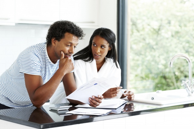 Worried couple working on personal finances