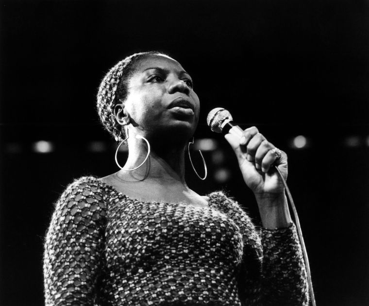 Nina Simone: Accomplished pianist, singer, songwriter and activist Nina Simone stayed true to her self throughout her career. She was beloved in the soul and blues realms, although she wanted to be seen as a folk singer. She drew inspiration from her time at Julliard and performed in jazz and soul clubs. In the 1950's the singer released her full length album and reached Top 40 status. In that time, she also became close to the civil rights movement. Her release of "Mississippi Goddam," helped paint a soundtrack to the movement. The song was inspired by the 1963 assassination of Medgar Evers and the Birmingham church bombing that killed four African-American girls. Her connection to the movement caused her to be blacklisted in Hollywood and criticized by her own husband, who was her manager. After finding continued fame overseas, the singer released more music to her own liking and returned to the states to perform a handful of times. Her story was told in the recent documentary "What Happened, Miss Simone?" unveiling her abusive past with her husband and troubles after her affiliation to the civil rights movement.