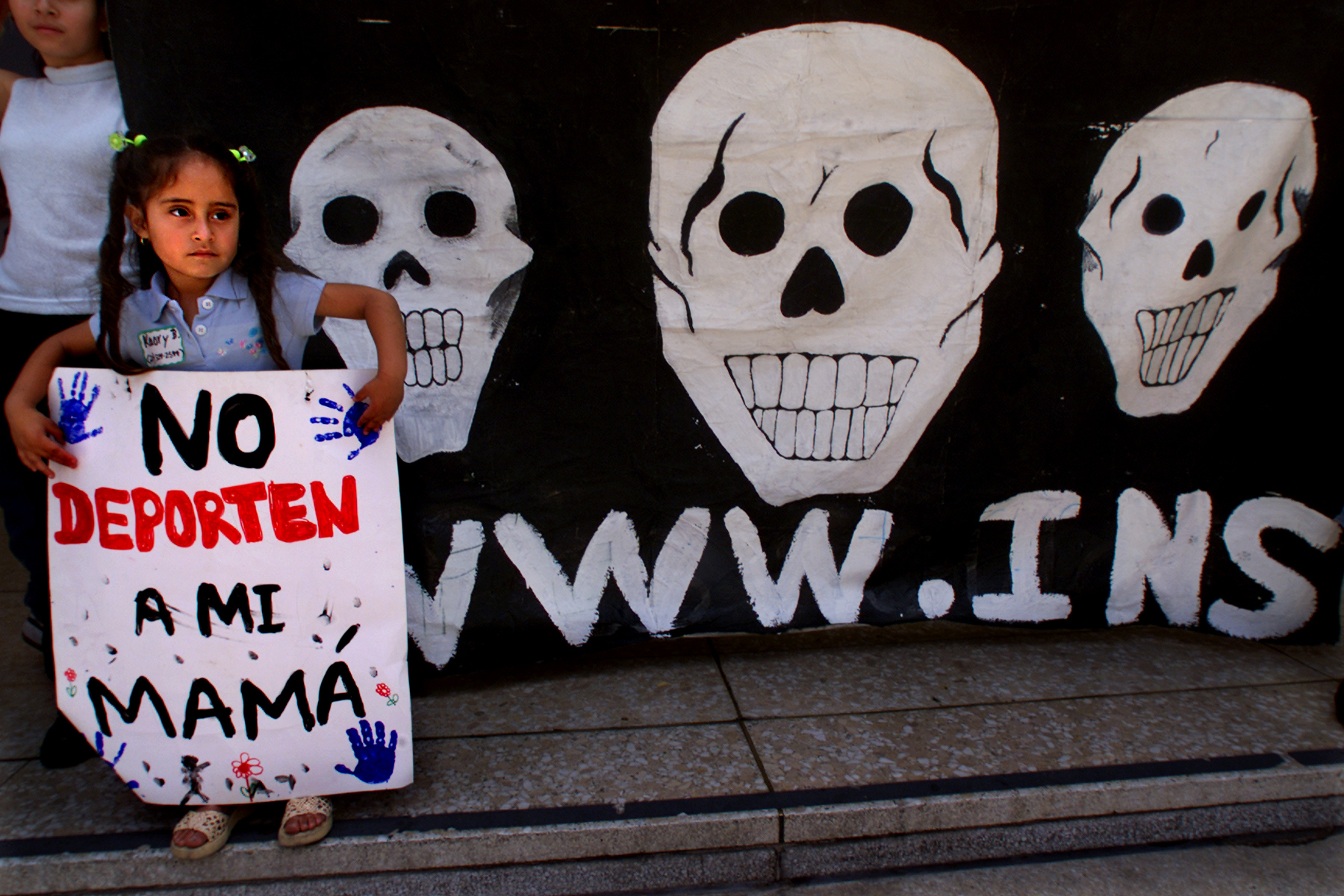 031359.ME.0611.vigil1.cc; Fouryearold Kaory Bernadino was one of two dozen supporters who marched