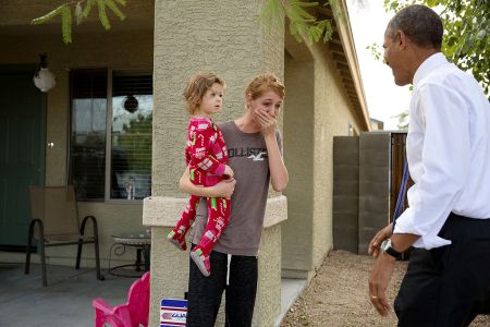 JANUARY: President Barack Obama greets neighbors after visiting a model home at the Nueva Villas at Beverly, a single-family housing development owned by local nonprofit organization Chicanos Por La Causa Inc. in Phoenix, Ariz.