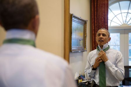MARCH: Obama is a classic man as he puts on a green tie in observance of St. Patrick’s Day.