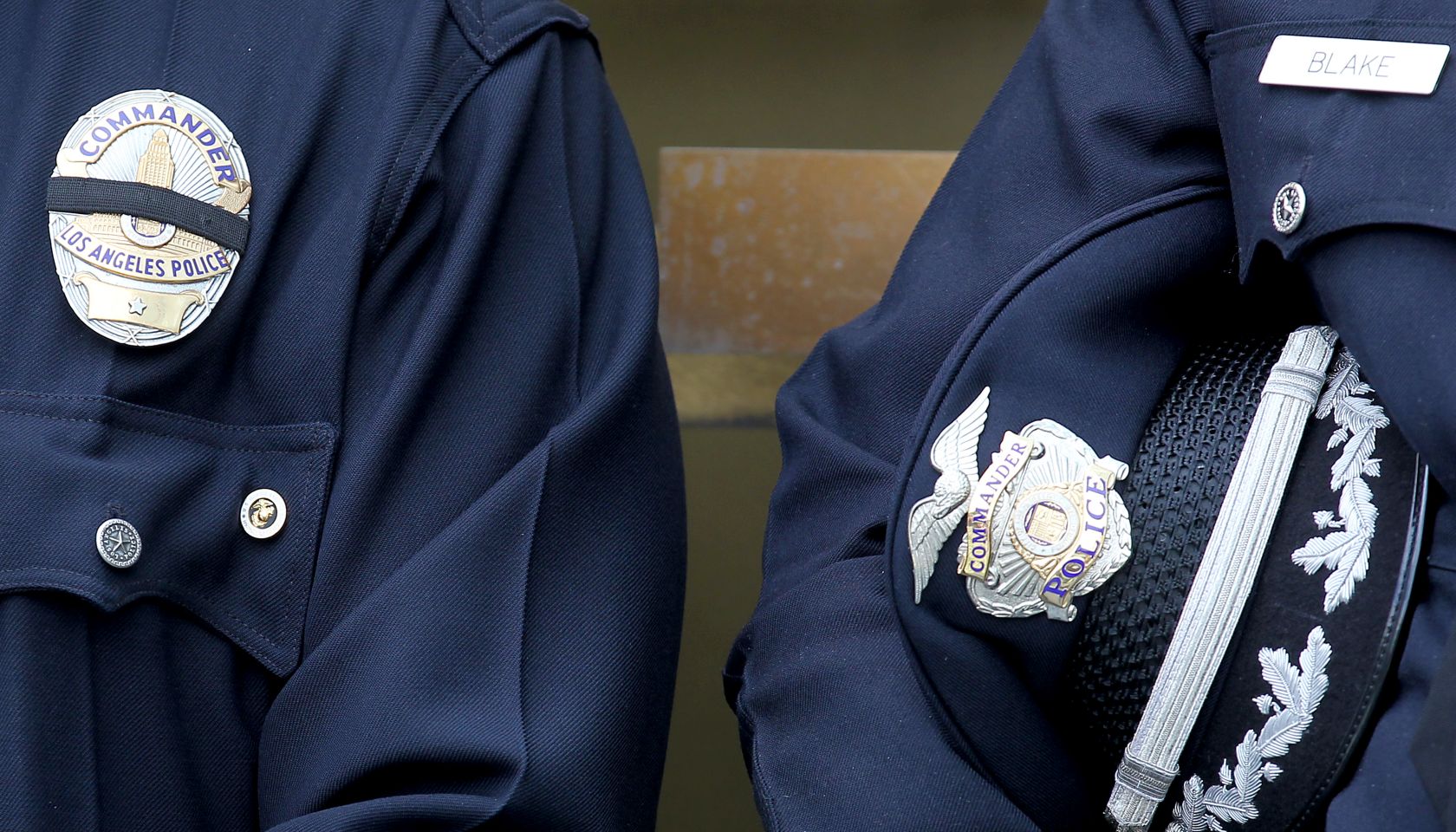 LOS ANGELES, CALIF. - DEC. 24, 2014. Police officers take a moment to pray Wednesday, Dec. 24, 2014