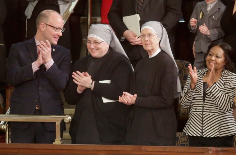 Two nuns from The Little Sisters of the Poor arrive clap for the president upon his arrival. The sisters were invited by Speaker of the House Paul Ryan (R-Wis.)