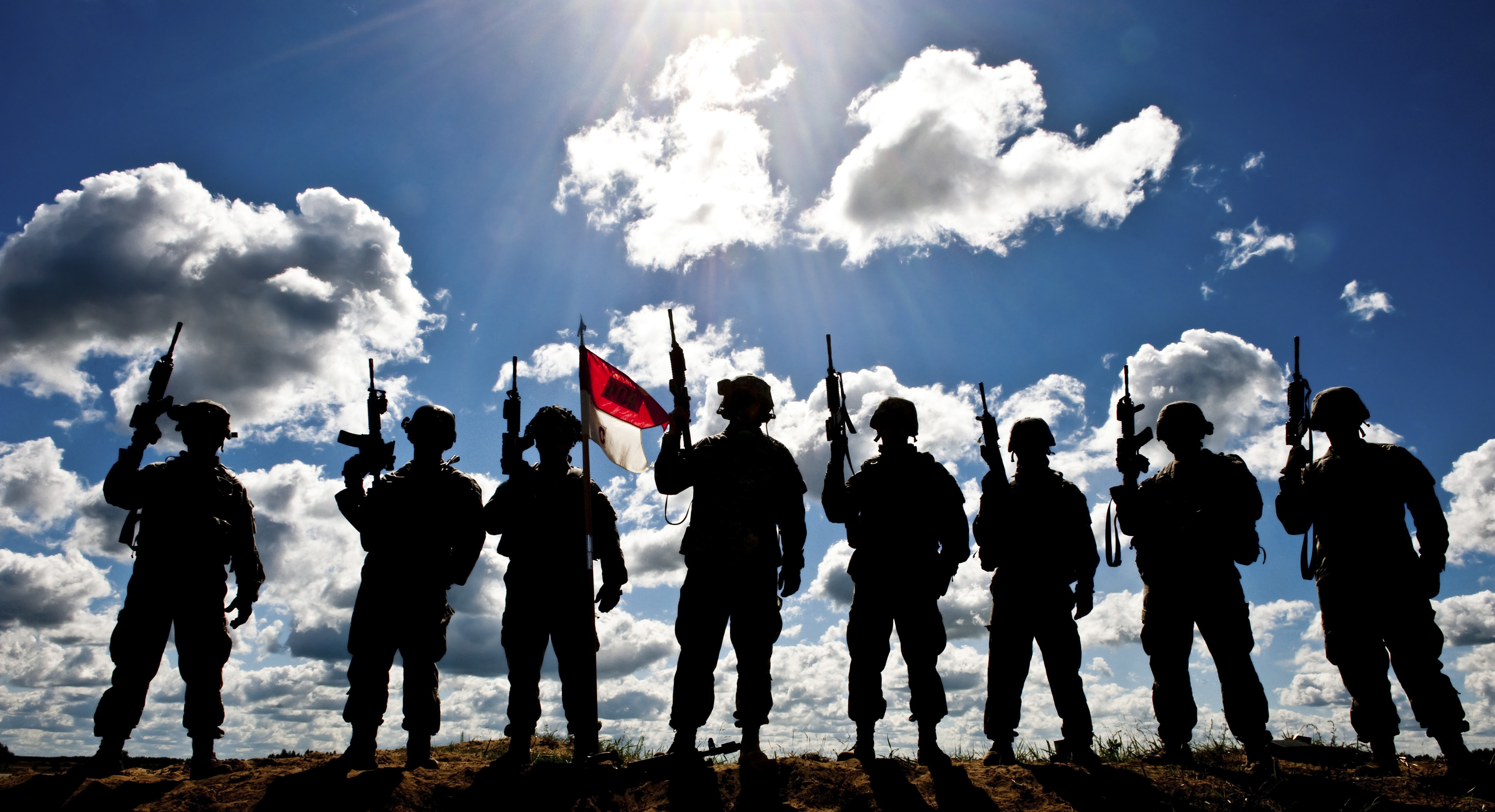 Silhouette of soldiers from the U.S. Army National Guard.