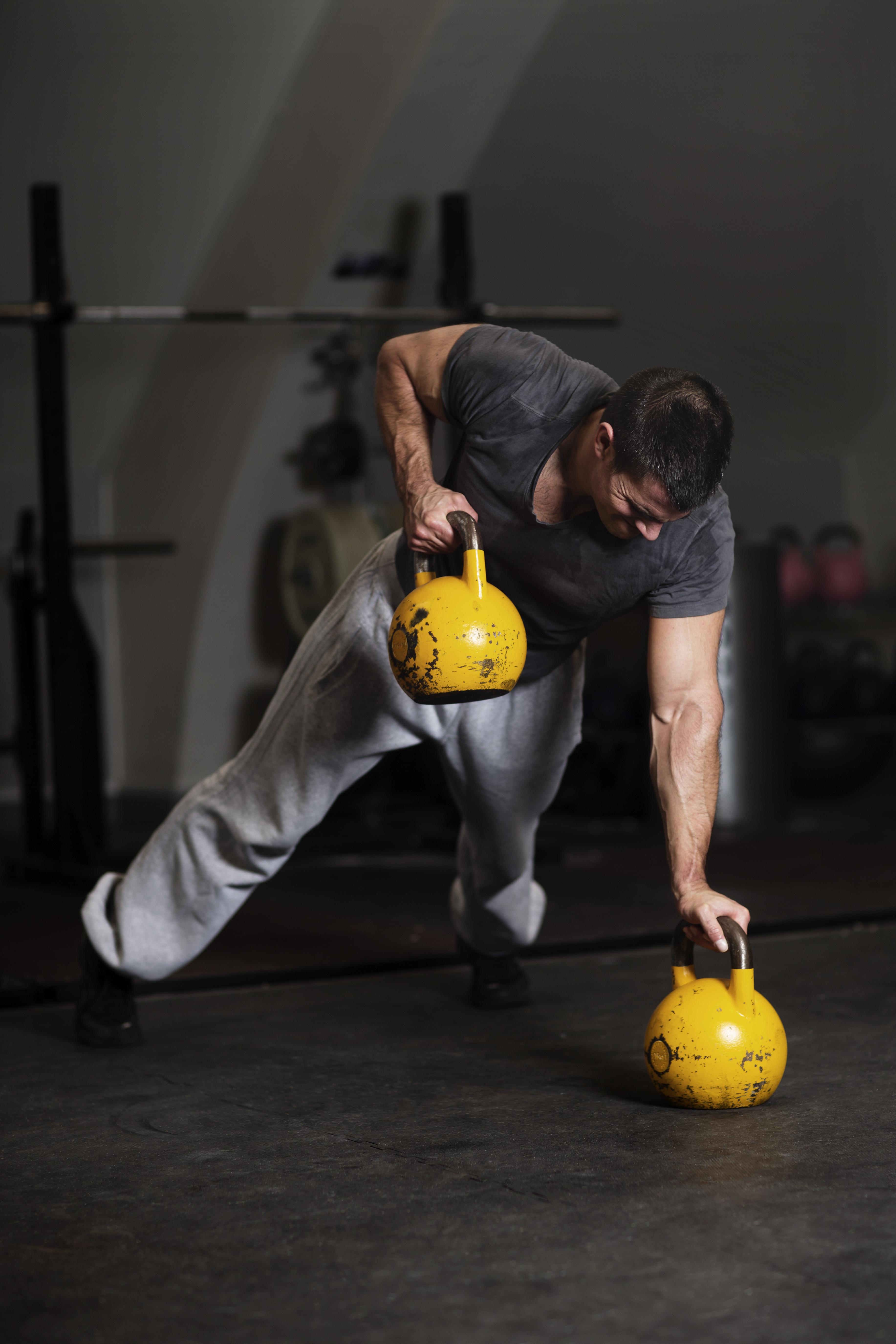 Man training in crossfit gym