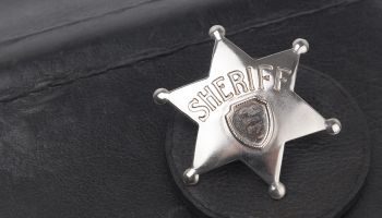 Sheriff's badge on dark background