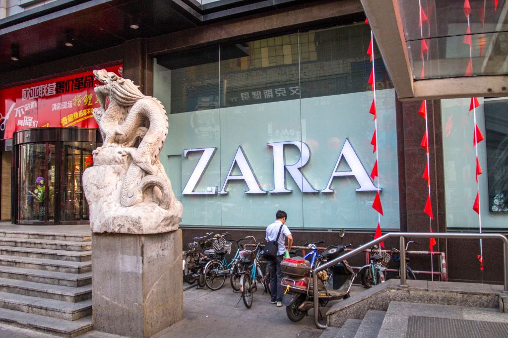 A parking corner for bikes outside a ZARA shop. With the...