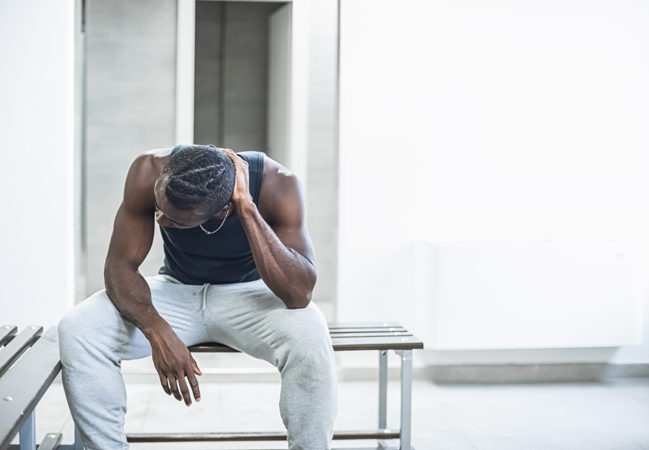Man sitting in a locker room