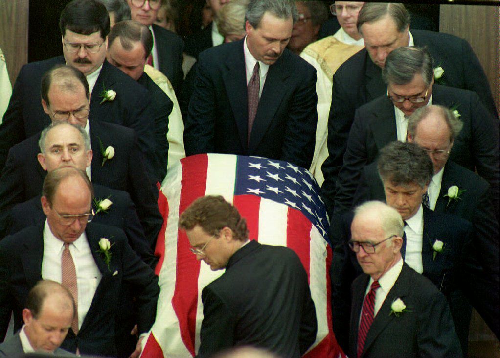 Pallbearers remove the casket of deputy White Hous