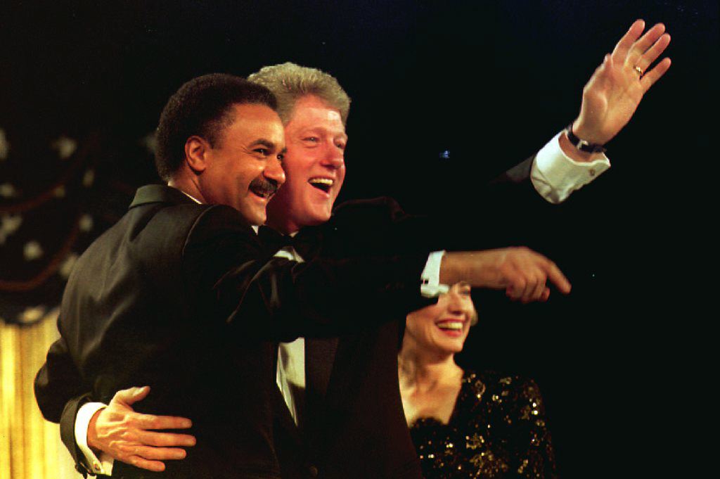 U.S. President-elect Bill Clinton (C) hugs Democra