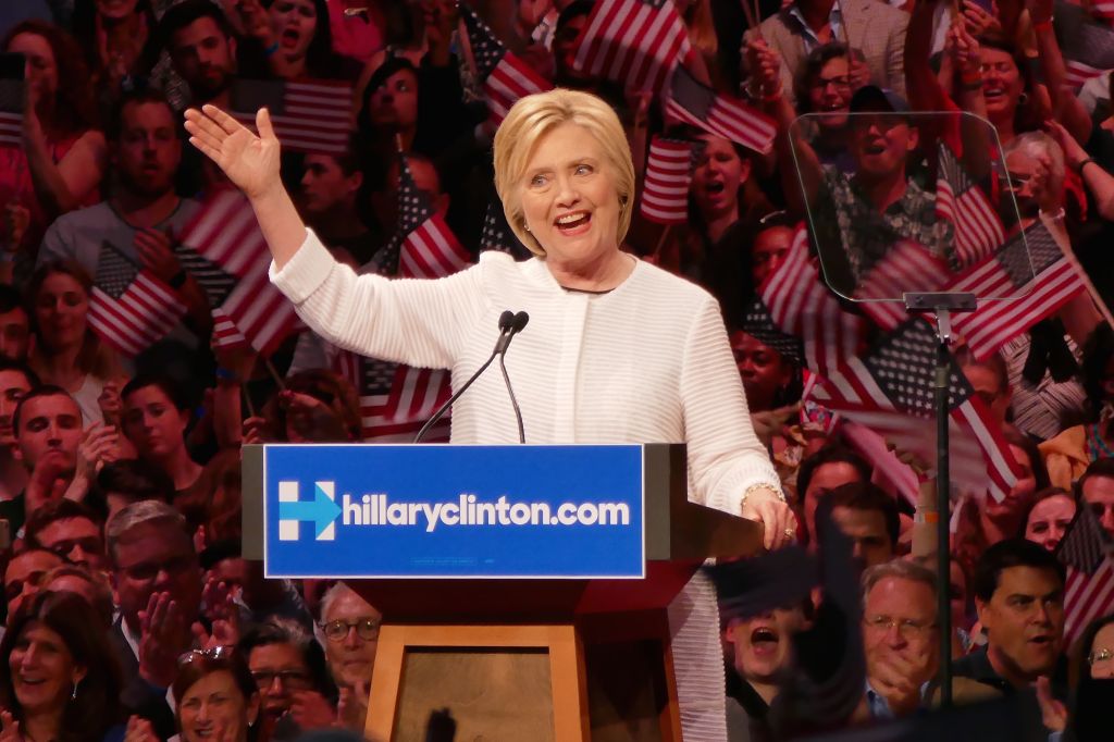 Clinton claims nomination as primaries near end