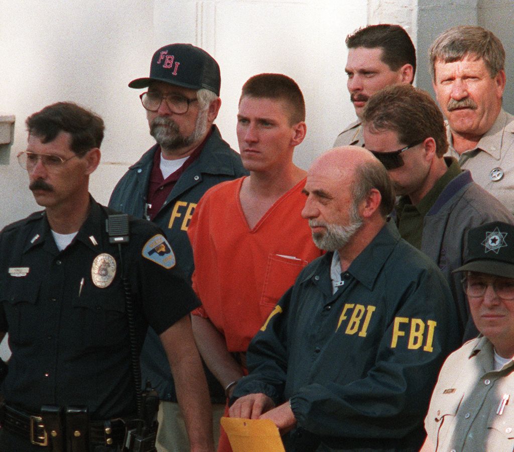 Timothy McVeigh, 27, (C) is led 21 April 1995 from