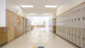 Lockers in empty high school corridor