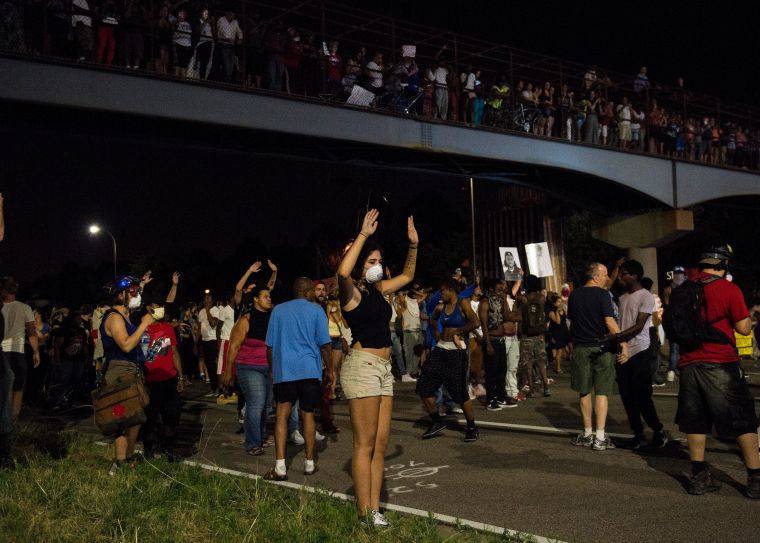 Activists Hold March Protesting Police Shooting Of Philando Castile