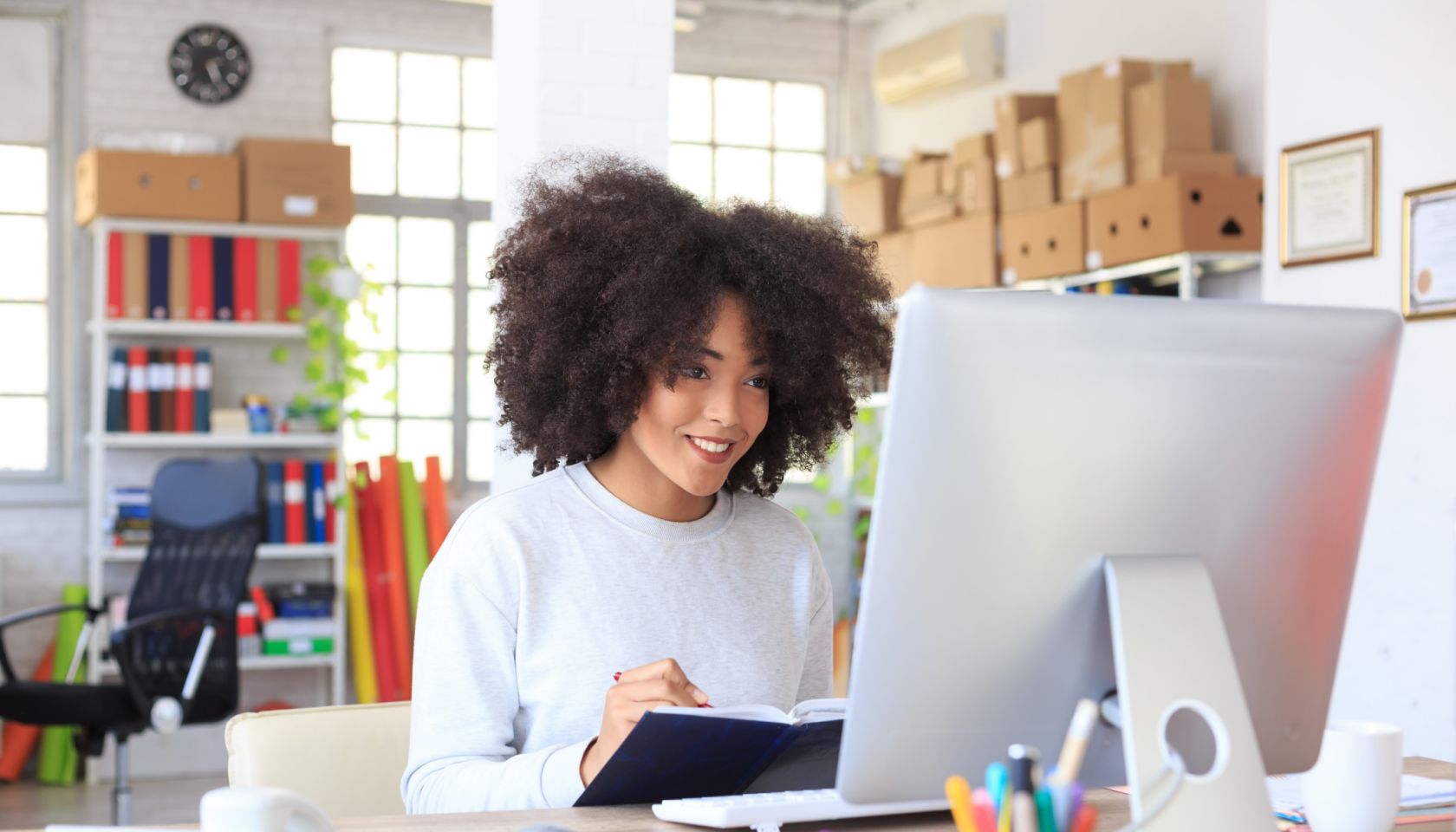 Smiling young woman at the office