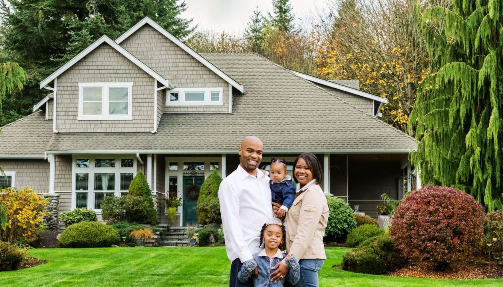 Family of Four at Home in Front Yard