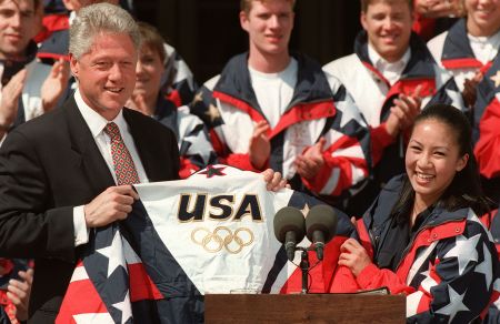 US President Bill Clinton(L) accepts a US Olympic
