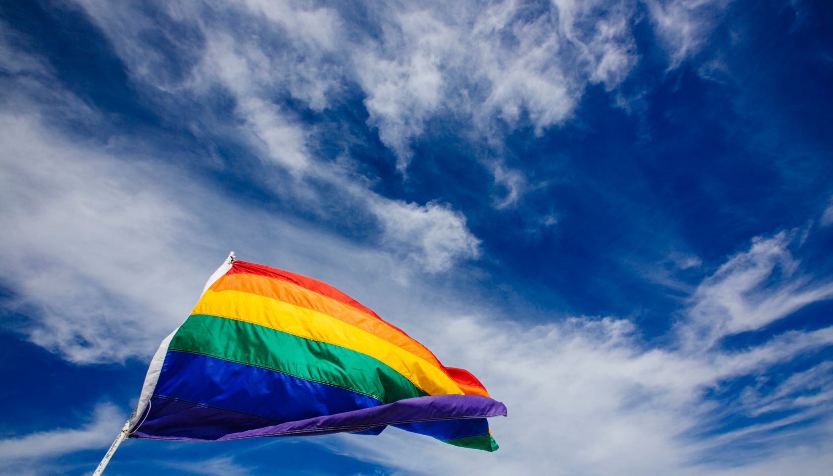 Rainbow flag waiving in the wind in South Beach, Miami