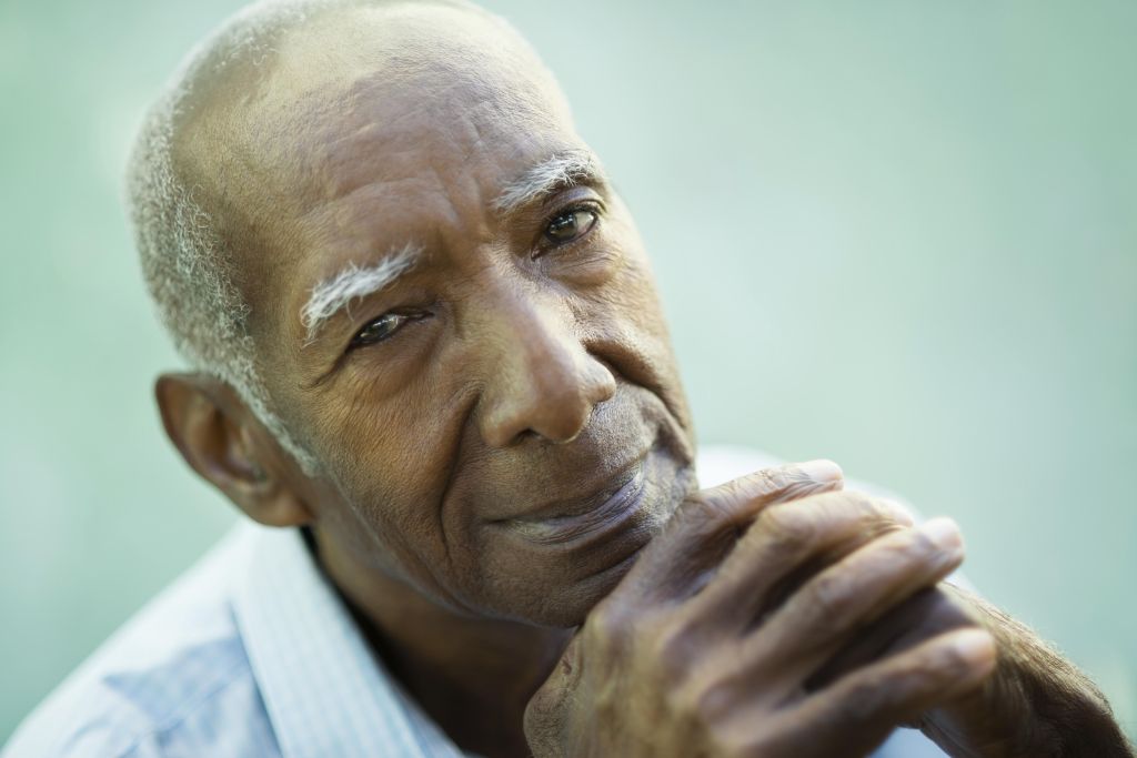 Portrait of happy senior hispanic man looking at camera and smiling. Close-up of face, copy space