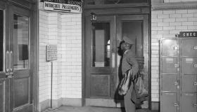 African American Soldier Reads Segregated Terminal Sign
