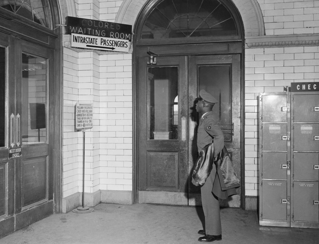 African American Soldier Reads Segregated Terminal Sign