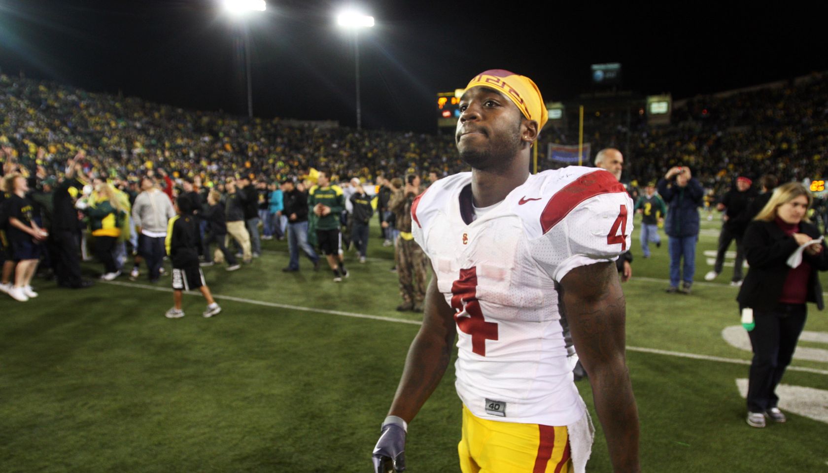 EUGENE, OREGON OCTOBER 31, 2009–USC's Joe McKnight walks off the field as fans celebrate the Oregon