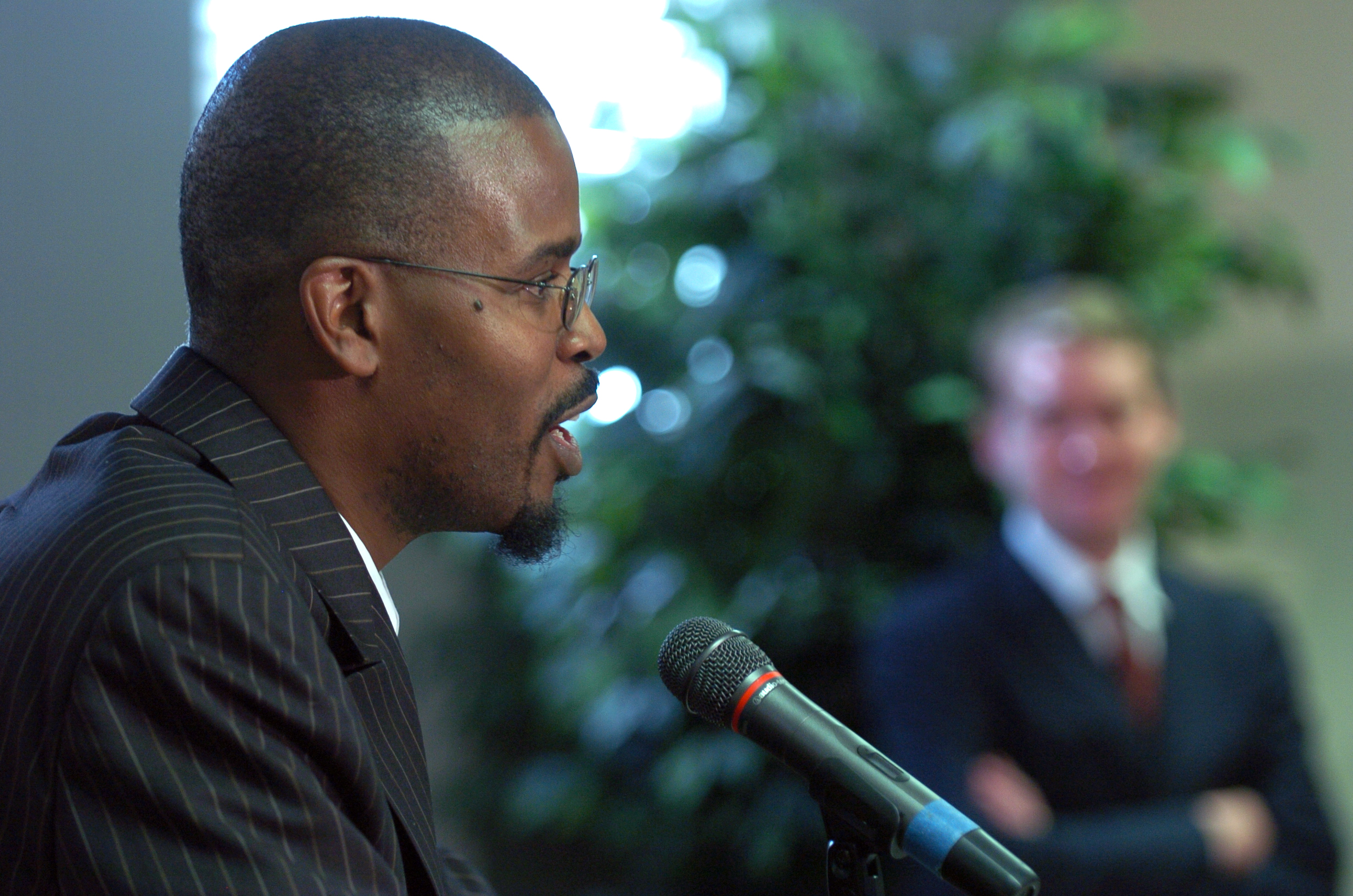 MONTBELLO ABOVE: Montbello principal Antwan Wilson addresses the media. In the backround is DPS Superintendent Michael Bennet. Denver Public Schools (DPS) Board member Kevin Patterson, Superintendent Michael Bennet, and Denver's City Council Presiden