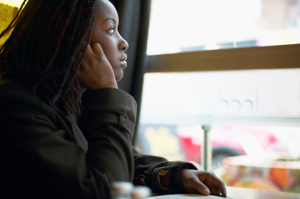 Young Woman Looking out the Window