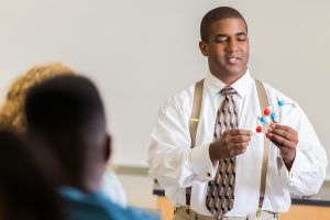 Knowledgeable science teacher teaches about molecules