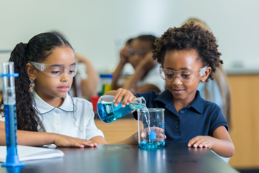 African American STEM school students in science class