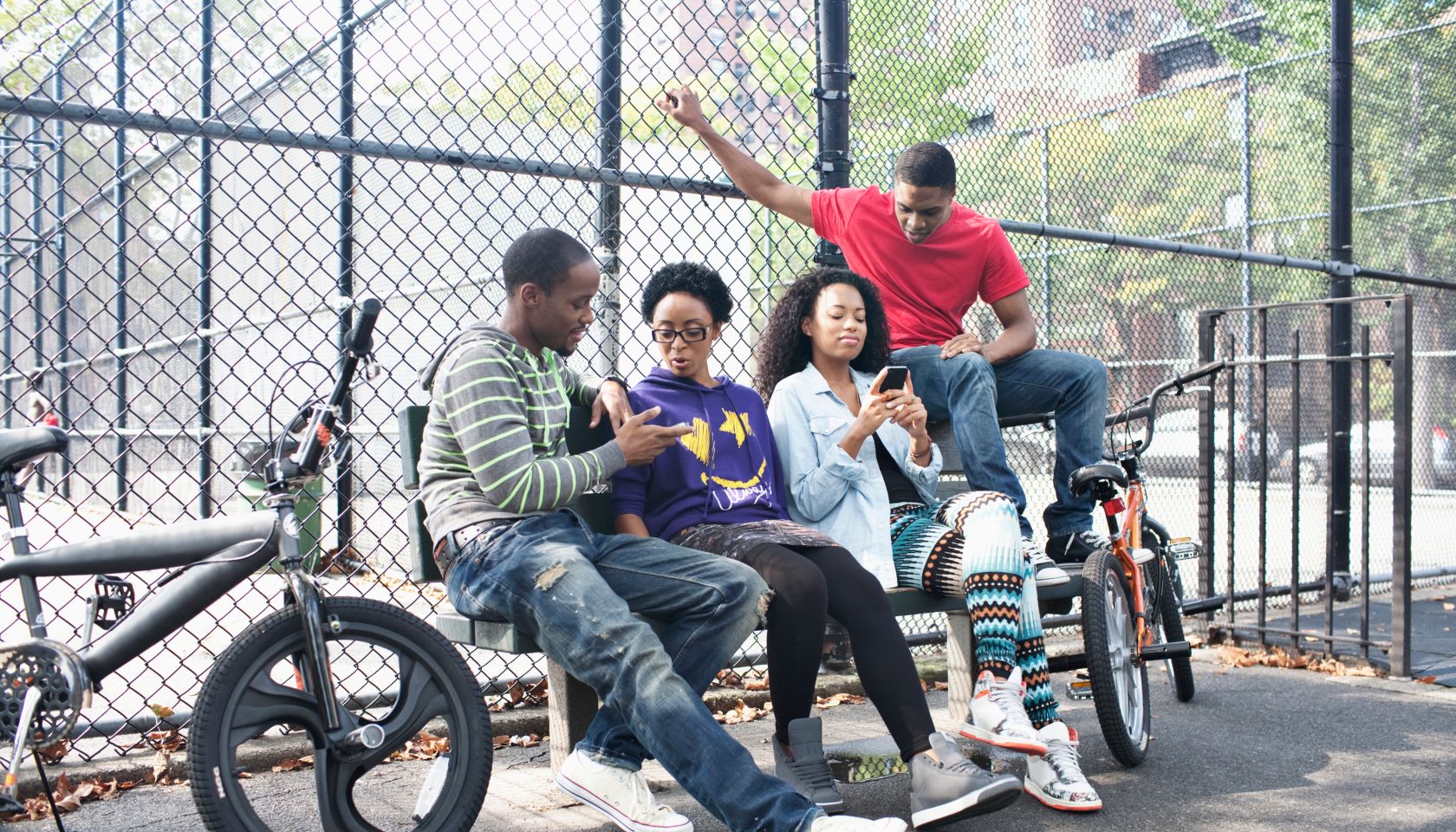 Group of friends relaxing in schoolyard