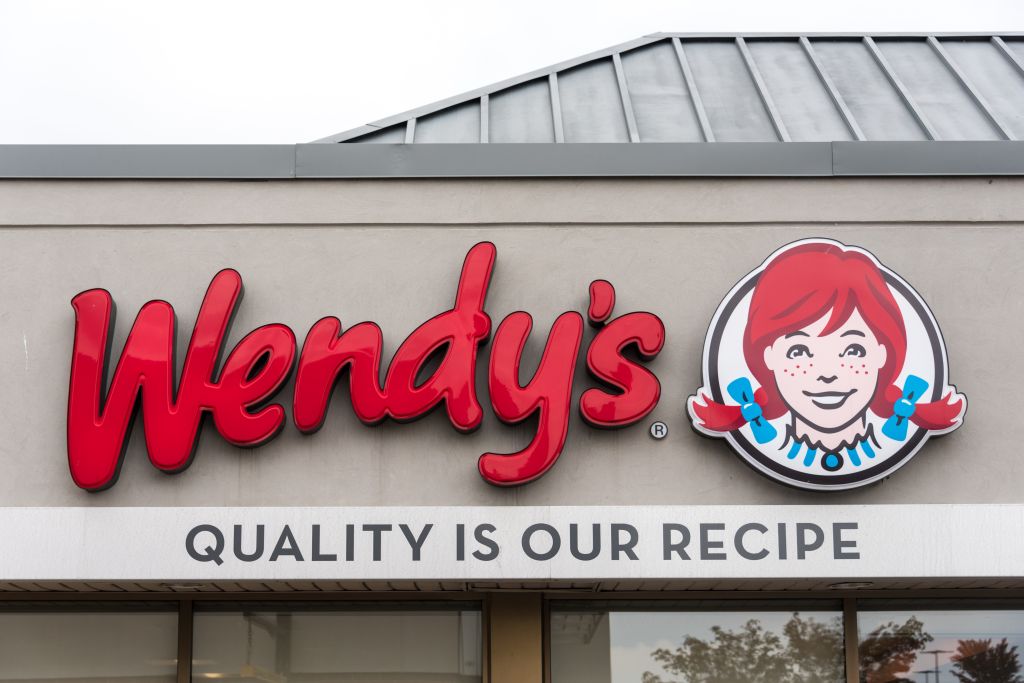 Wendy's sign. Entrance of an outlet of famous American fast...