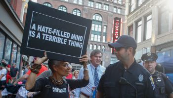 Activist with Stop Patriarchy with Cleveland police officer...